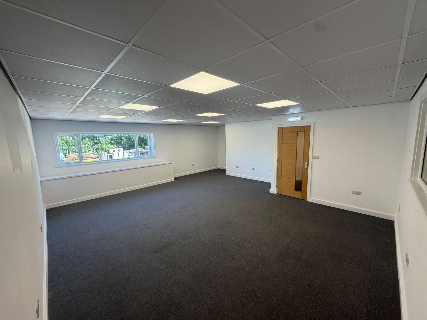Spacious first-floor office with natural light from side and rear windows