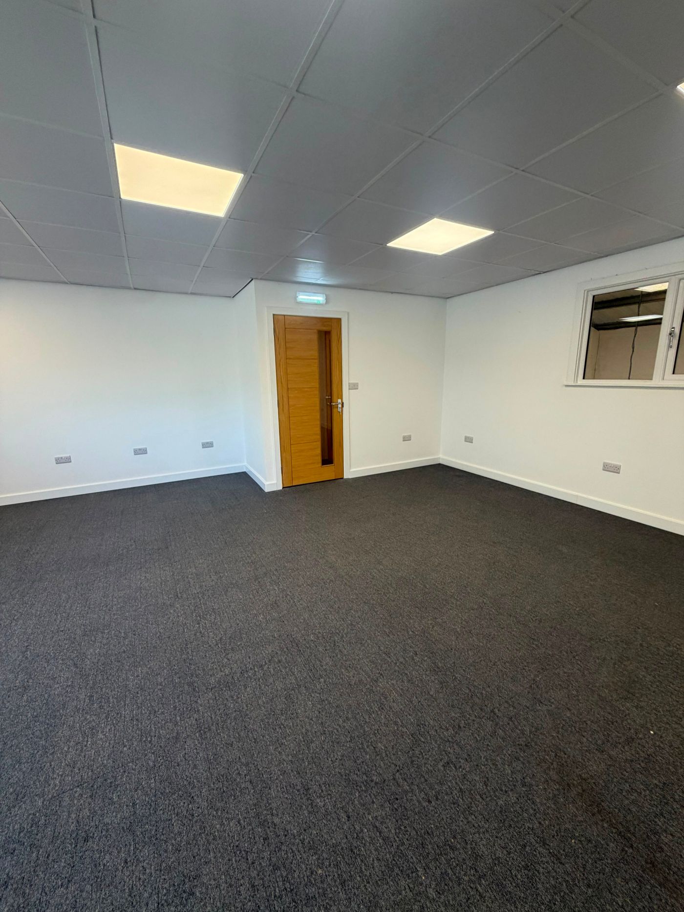 Finished first-floor office ready for occupation with oak door and LED lighting